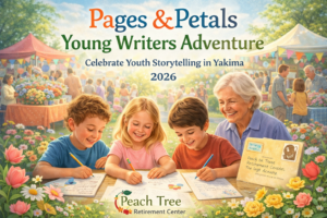 Three smiling children sit at a table writing and drawing outdoors with an elderly woman beside them, while families browse vendor booths in the background at the Pages & Petals Young Writers Adventure in Yakima.