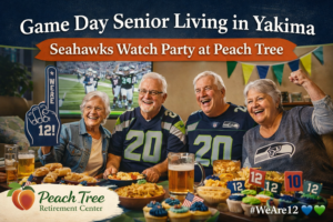Smiling seniors in Seahawks gear celebrating game day at Peach Tree Retirement Center in Yakima with snacks, foam fingers, and football-themed cupcakes.