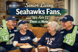 Senior citizens wearing Seahawks gear laugh together holding “We Are 12” signs in an independent senior living community