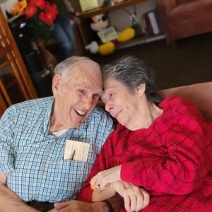 older couple smiling and hugging