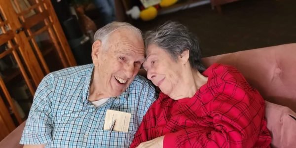 older couple smiling and hugging